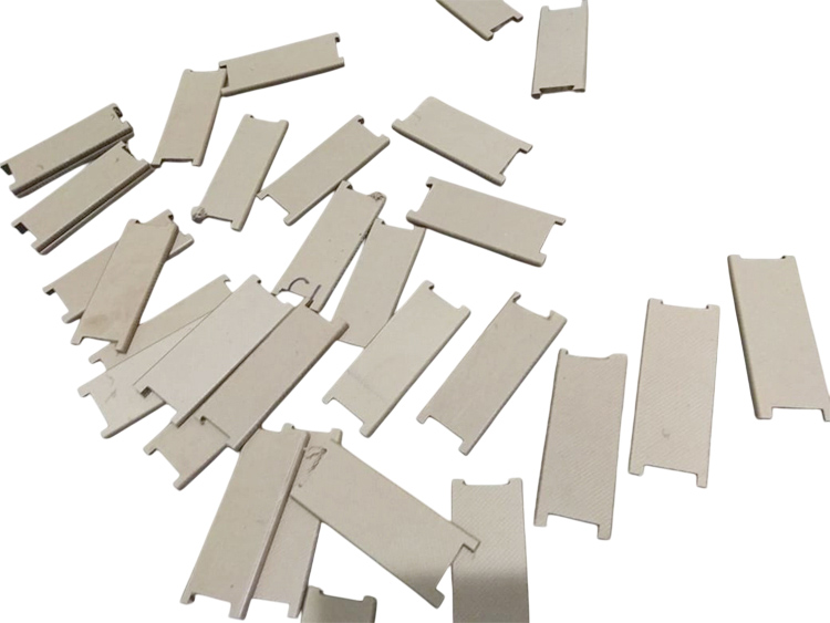 High density pre-compressed pressboards for short-circuit resistant transformer coils